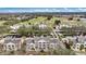 Aerial perspective showcasing expansive community and golf course at 1310 Seven Eagles Ct # 301, Reunion, FL 34747