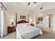 Main bedroom with ensuite bathroom and king-size bed at 1310 Seven Eagles Ct # 301, Reunion, FL 34747