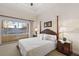 Spacious bedroom with king-size bed and balcony access at 1310 Seven Eagles Ct # 301, Reunion, FL 34747