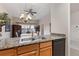 Kitchen features granite countertops and stainless steel sink at 1310 Seven Eagles Ct # 301, Reunion, FL 34747