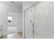 Clean bathroom with a shower and access to bedroom at 1365 Hanoverian Dr, Lake Alfred, FL 33850