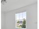 Well-lit bedroom with a window overlooking the street at 1365 Hanoverian Dr, Lake Alfred, FL 33850