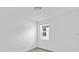 Well-lit bedroom featuring a large window and plush carpeting at 1365 Hanoverian Dr, Lake Alfred, FL 33850