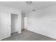 Bright bedroom with a spacious closet and neutral walls at 1365 Hanoverian Dr, Lake Alfred, FL 33850