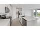 Modern kitchen with white cabinets, stainless steel appliances, and an island at 1365 Hanoverian Dr, Lake Alfred, FL 33850
