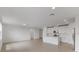 Bright and airy living room with tile flooring and a view into the kitchen at 1365 Hanoverian Dr, Lake Alfred, FL 33850