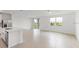 Spacious living room with tile floors and access to the back patio at 1365 Hanoverian Dr, Lake Alfred, FL 33850