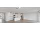 Open living room with tile flooring and kitchen island at 1365 Hanoverian Dr, Lake Alfred, FL 33850