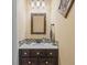 Small bathroom with vanity and mosaic tile at 1402 Lisbon Ct, Davenport, FL 33896
