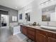 Elegant bathroom with double vanity and soaking tub at 1402 Lisbon Ct, Davenport, FL 33896