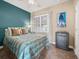 Guest bedroom with a comfy bed and a dresser at 1402 Lisbon Ct, Davenport, FL 33896