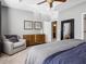 Spacious bedroom with dresser, armchair, and large mirror at 1402 Lisbon Ct, Davenport, FL 33896