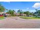 Community entrance with fountain and lush landscaping at 1402 Lisbon Ct, Davenport, FL 33896