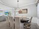 Elegant dining room with dark wood table and chandelier at 1402 Lisbon Ct, Davenport, FL 33896