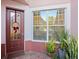 Inviting entryway with decorative door and window at 1402 Lisbon Ct, Davenport, FL 33896