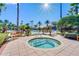 Relaxing hot tub surrounded by lush landscaping at 1402 Lisbon Ct, Davenport, FL 33896
