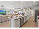 Island kitchen with granite countertops and stainless steel appliances at 1402 Lisbon Ct, Davenport, FL 33896