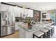 Modern kitchen with stainless steel appliances and granite island at 1402 Lisbon Ct, Davenport, FL 33896