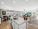 Island kitchen with granite countertops and white cabinets at 1402 Lisbon Ct, Davenport, FL 33896