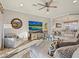 Living room with sectional sofa, large TV, and comfortable seating at 1402 Lisbon Ct, Davenport, FL 33896