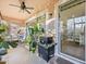 Outdoor patio with seating and grill at 1402 Lisbon Ct, Davenport, FL 33896