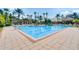 Inviting community pool with ample lounge space at 1402 Lisbon Ct, Davenport, FL 33896