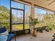 Relaxing screened porch overlooking backyard pond at 1402 Lisbon Ct, Davenport, FL 33896