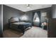 Dark-walled bedroom with a queen-size bed and window at 142 Southern Pecan Cir # 207, Winter Garden, FL 34787