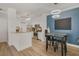 Modern kitchen with stainless steel appliances and light-colored cabinets at 142 Southern Pecan Cir # 207, Winter Garden, FL 34787