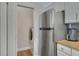 Kitchen features stainless steel appliances and laundry closet at 142 Southern Pecan Cir # 207, Winter Garden, FL 34787