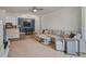 Open living room and kitchen area with sectional sofa at 142 Southern Pecan Cir # 207, Winter Garden, FL 34787