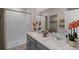 Modern bathroom with double vanity and walk-in shower at 1672 Hummingbird Rd, Winter Haven, FL 33884