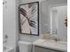 Bathroom with a toilet, bathtub, and sink at 1672 Hummingbird Rd, Winter Haven, FL 33884