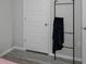 White door and black blanket ladder in bedroom at 1672 Hummingbird Rd, Winter Haven, FL 33884