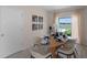 Light and airy dining room featuring a wood table and six chairs at 1672 Hummingbird Rd, Winter Haven, FL 33884
