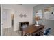 Home office with desk, storage, and view of bathroom at 1672 Hummingbird Rd, Winter Haven, FL 33884