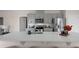 Sleek kitchen island with white quartz countertop and modern fixtures at 1672 Hummingbird Rd, Winter Haven, FL 33884