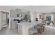 Modern kitchen with gray cabinets, quartz countertops, and stainless steel appliances at 1672 Hummingbird Rd, Winter Haven, FL 33884