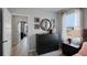 Bright bedroom with dresser and view of another room at 1680 Hummingbird Rd, Winter Haven, FL 33884