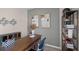 Spacious home office with wood desk, storage, and decorative wall art at 1680 Hummingbird Rd, Winter Haven, FL 33884