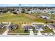 Aerial of homes with community water tower in the background at 1952 Piedmont Ct, Mascotte, FL 34753