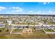 Aerial view of homes in the neighborhood with yard marked in red at 1952 Piedmont Ct, Mascotte, FL 34753