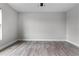 This bedroom features wood floors and a ceiling fan at 1952 Piedmont Ct, Mascotte, FL 34753