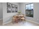 Cozy dining area featuring a window, table with chairs, and decorative wall art at 1952 Piedmont Ct, Mascotte, FL 34753