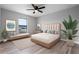 The main bedroom offers a ceiling fan, wood floors and views of the neighborhood at 1952 Piedmont Ct, Mascotte, FL 34753