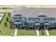 Two-story townhouses with gray roofs and landscaping at 2785 Flushing Dr, Apopka, FL 32703