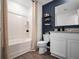 Clean bathroom with white vanity, shower, and dark blue walls at 2785 Flushing Dr, Apopka, FL 32703