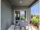 Covered patio with table and chairs, view of backyard at 2785 Flushing Dr, Apopka, FL 32703