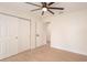 Bright bedroom with ceiling fan and sliding door closet at 2932 Carriage Dr, Daytona Beach, FL 32119