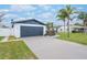 Updated home exterior features modern design and a large driveway at 2932 Carriage Dr, Daytona Beach, FL 32119